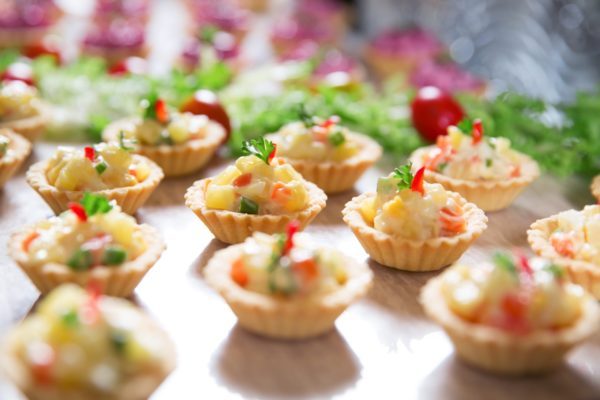 Tartlets with Vegetable Salad on Buffet Table